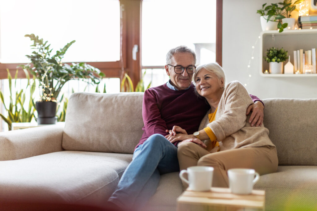 portrait of a happy senior couple relaxing together at home